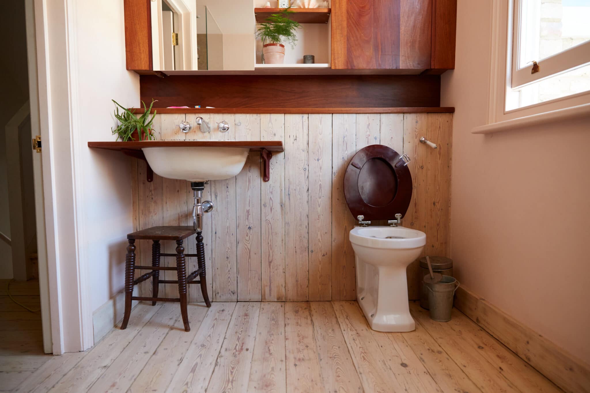 Empty Interior Of Contemporary Cloakroom With Sink And Toilet