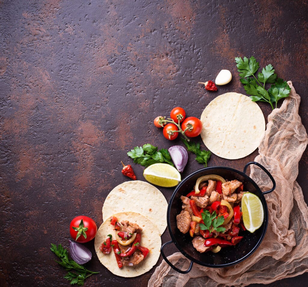 Tacos with standard ingredients reshaped into exciting new offerings, on a dark background.
